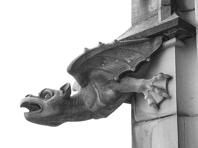 architectural photography of gray dragon concrete statue thumbnail