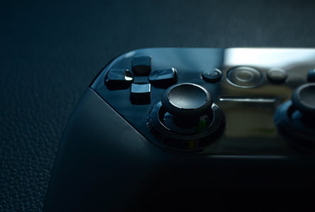 black gamepad on =black top thumbnail