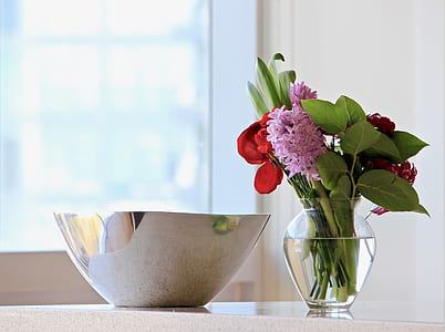 round gray stainless steel bowl near flowers thumbnail