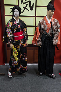 woman wearing red, black, and yellow floral kimono thumbnail