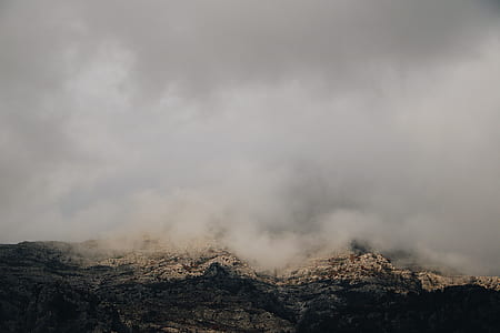 gray rock formation with fog thumbnail