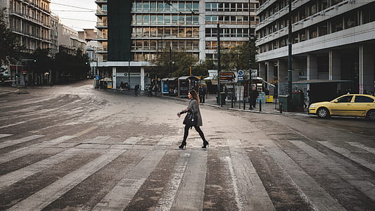 woman walking on pedestrian lane thumbnail