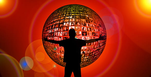 silhouette of man in front of sphere with photo of people thumbnail