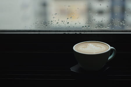white mug filled coffee with coffee-art thumbnail