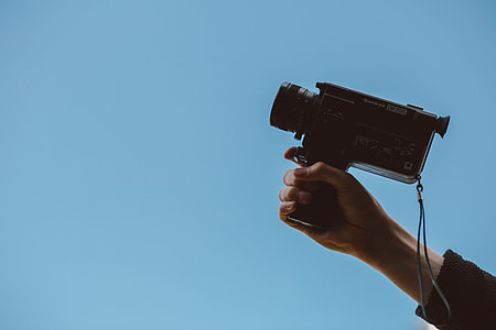 person holding camcorder thumbnail