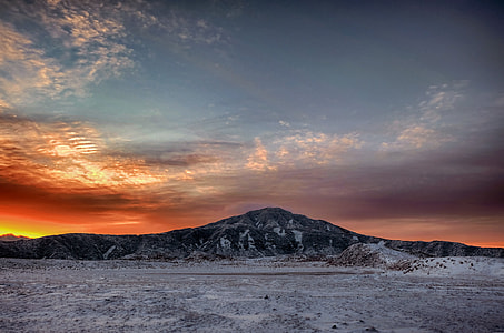 landscape photography of mountain under cirrus clouds thumbnail