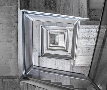 grayscale photo of spiral stairs thumbnail