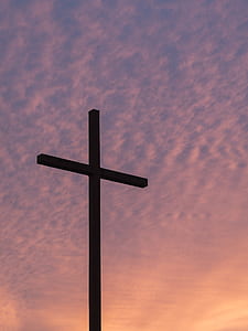 silhouette of cross under against calm sky thumbnail