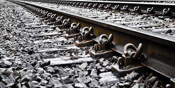 selective focus photography of black train rail thumbnail