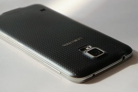 black Samsung Android smartphone on white surface thumbnail