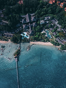aerial photography of houses and buildings near shore thumbnail