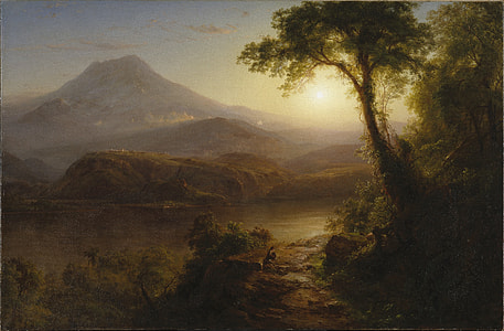 person taking a photo of mountain during sunset thumbnail