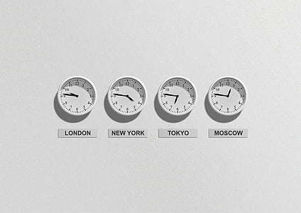four round white analog clocks with London, New York, Tokyo, and Moscow labels thumbnail
