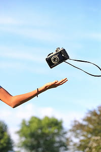 person catching camera thumbnail