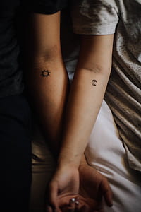two person with moon and sun tattoo thumbnail