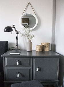 black gooseneck table lamp on gray wooden drawer thumbnail