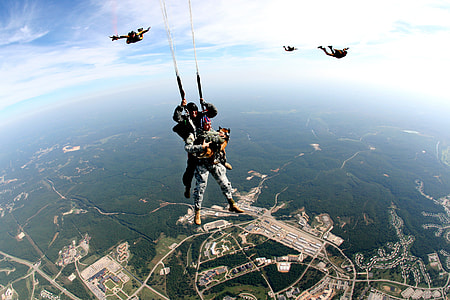 people parachuting on sky during daytime thumbnail