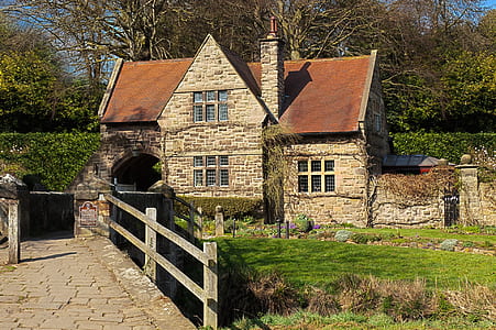 brown brick house in front of bridge thumbnail