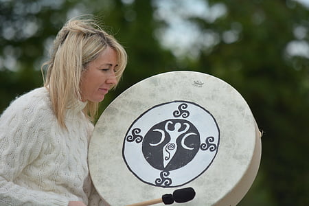 woman holding gong and stick thumbnail