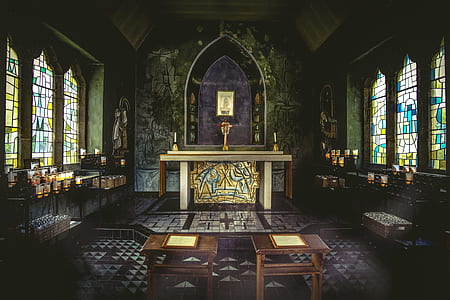 brown wooden furniture inside church thumbnail