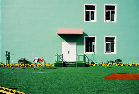 green lawn near white door thumbnail