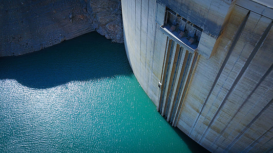 aerial photo of body of water near concrete building thumbnail