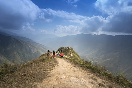 four girls standing on top of mountain thumbnail
