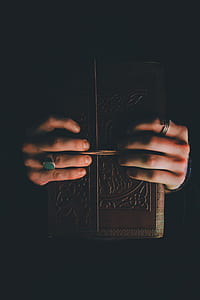 person holding book thumbnail
