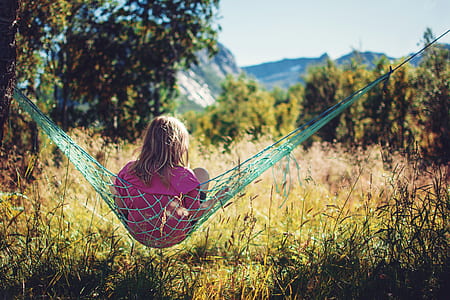 person sitting on green hammock thumbnail
