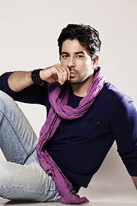 Man Doing A Pose While Sitting thumbnail