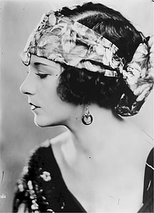 grayscale photo of woman in floral headband thumbnail