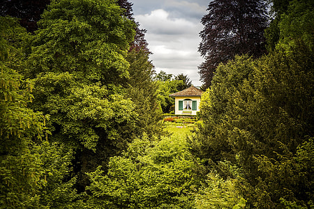 white concrete house with brown roof during daytime thumbnail