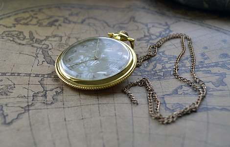gold-colored analog pocket watch thumbnail