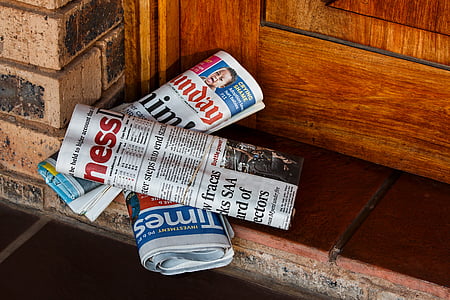 three newspapers on the floor thumbnail