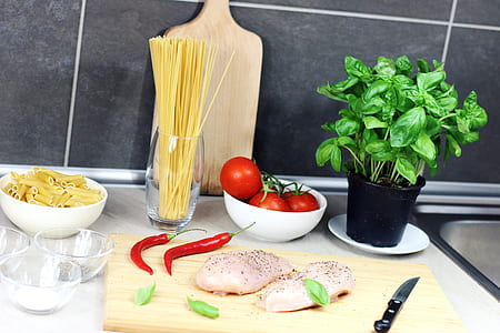 chicken meats placed on chopping board thumbnail