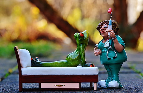 red-eyed frog ceramic figurine on bed thumbnail