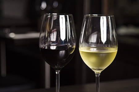 two wine glasses with red and white wine thumbnail