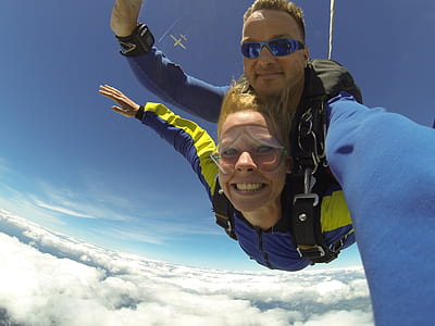Fisheye Photography of Man and Woman Sky Diving thumbnail
