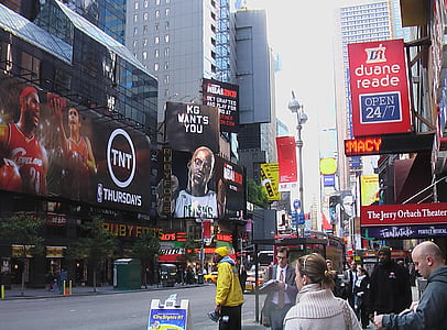 crowded street with billboards and buildings thumbnail