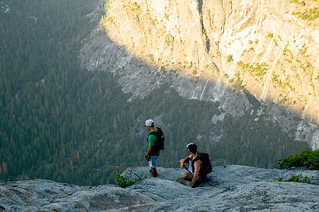 two men standing on edge of cliff thumbnail