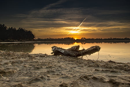 landscape photo of body of water in sunset thumbnail