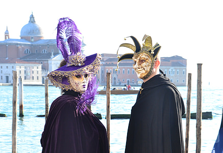 two person wearing masks beside body of water thumbnail