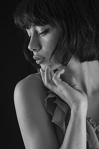 greyscale photo of woman wearing sleeveless top thumbnail
