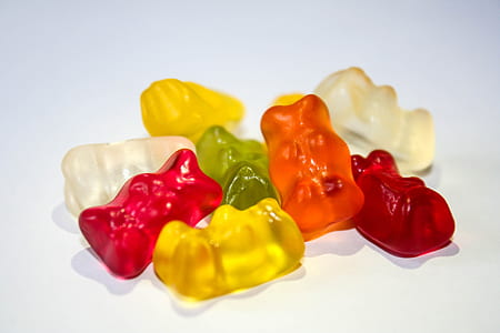 assorted-color gummy bears on white surface thumbnail