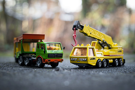 two yellow and green truck miniatures thumbnail