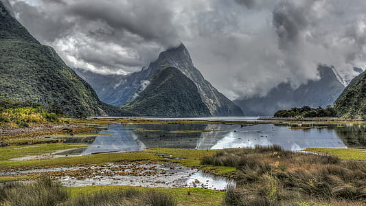mountain surrounded body of water thumbnail