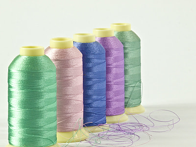 five rolled threads on table thumbnail