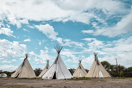 tiki tents under cirrus clouds thumbnail