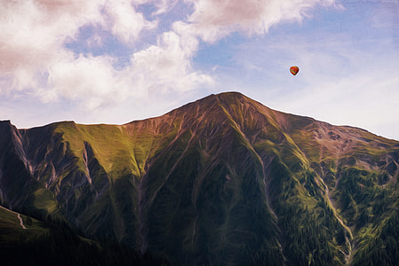 air balloon above hill during daytime thumbnail