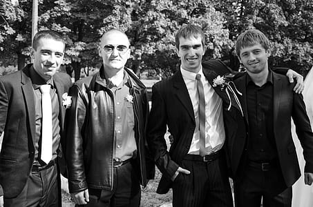 grayscale portrait of four men thumbnail